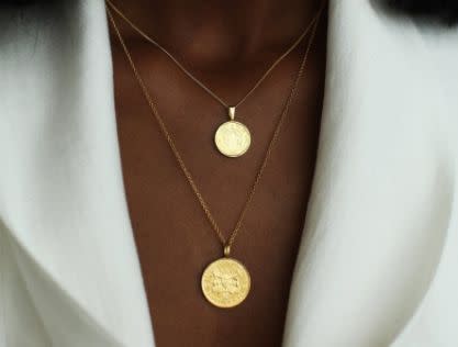 This Black-owned Canadian Etsy shop specializes in stunning pendant necklaces with a variety of designs and illustrations. Shop the <a href="https://fave.co/2A5VlJ1" target="_blank" rel="noopener noreferrer">Double Up coin necklace stack in gold vermeil for $187</a> at <a href="https://fave.co/3csRWRG" target="_blank" rel="noopener noreferrer">OmiWoods on Etsy.</a>