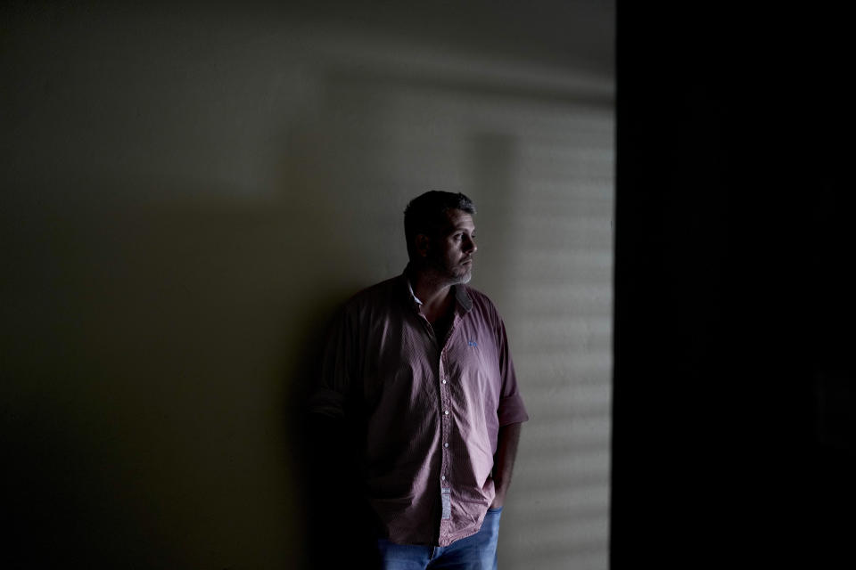 Pedro Sandoval, who was stolen as a baby during Argentina's bloody dictatorship (1976-1983) and grew up with a different identity, poses for a portrait outside his home in Buenos Aires, Argentina, Monday, Aug. 7, 2023. Sandoval's parents are among the 30,000 missing persons counted by humanitarian organizations, and he was identified as a grandson in 2006. (AP Photo/Natacha Pisarenko)