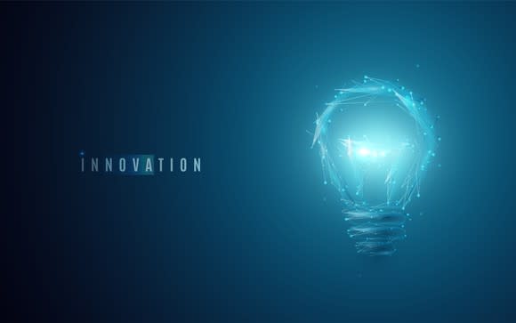 A light bulb shining next to the word innovation