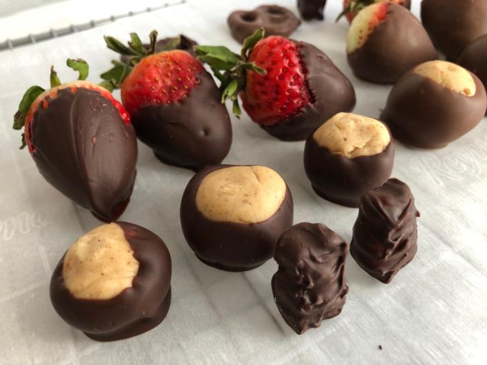 Chocolate-dipped strawberries, buckeyes and gummy bears.