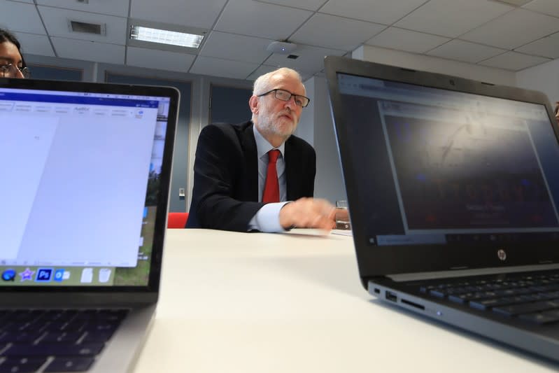 Britain's Labour Party leader Jeremy Corbyn talks with students at Lancaster University regarding the party's plans to deliver fast and free full-fibre broadband across the country if they win the general election, in Lancaster