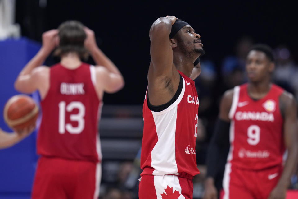 Canada guard Shai Gilgeous-Alexander reacts after receiving a technical foul during a Basketball World Cup semi final game against Serbia in Manila, Philippines, Friday, Sept. 8, 2023. (AP Photo/Michael Conroy)