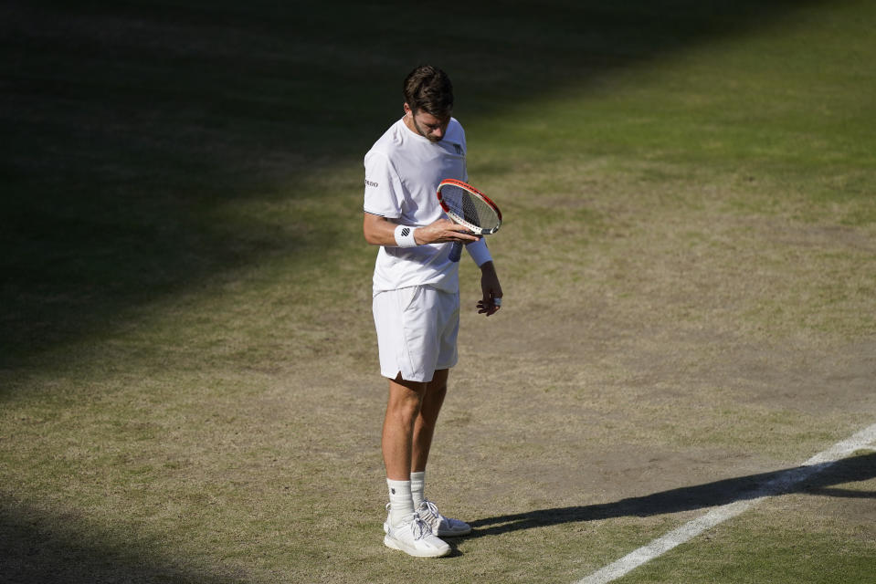 Britain's Cameron Norrie reacts as he loses a point against Serbia's Novak Djokovic in a men's singles semifinal on day twelve of the Wimbledon tennis championships in London, Friday, July 8, 2022. (AP Photo/Gerald Herbert)