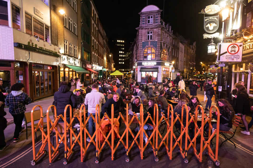 <p>People gather in Soho, London, where streets were closed to traffic as bars and restaurants opened for outside eating and drinking, as lockdown measures are eased across the UK. Picture date: Tuesday April 13, 2021. Photo credit should read: Matt Crossick/Empics</p>
