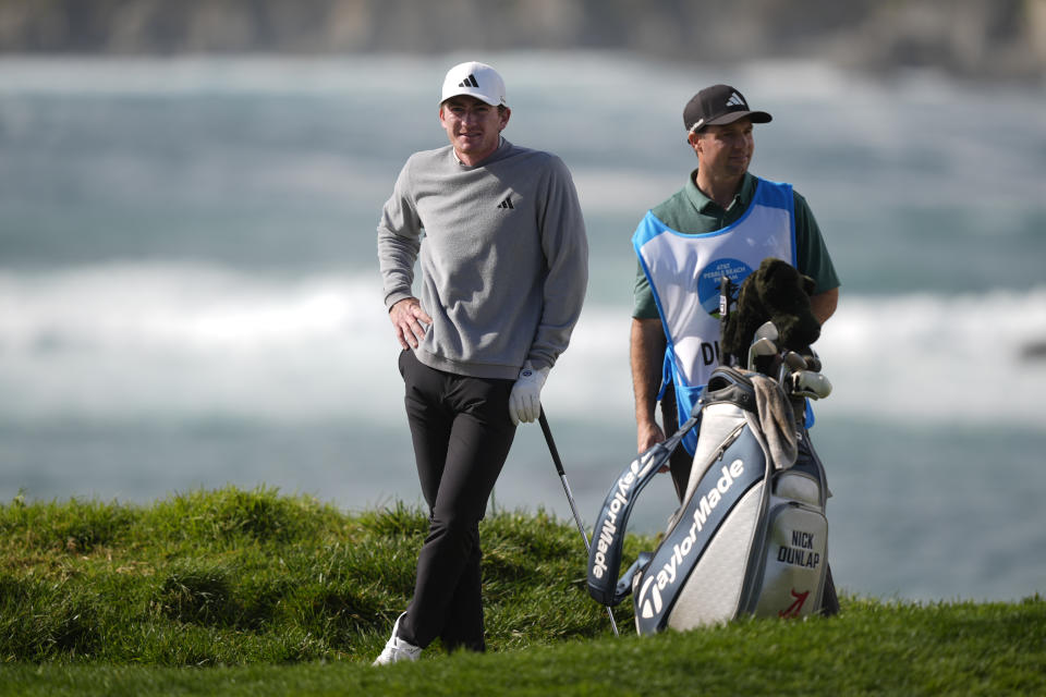 Nick Dunlap waits to hit on the fourth green on the Pebble Beach Golf Links during the first round of the AT&T Pebble Beach National Pro-Am golf tournament Thursday, Feb. 1, 2024, in Pebble Beach, Calif. (AP Photo/Ryan Sun)