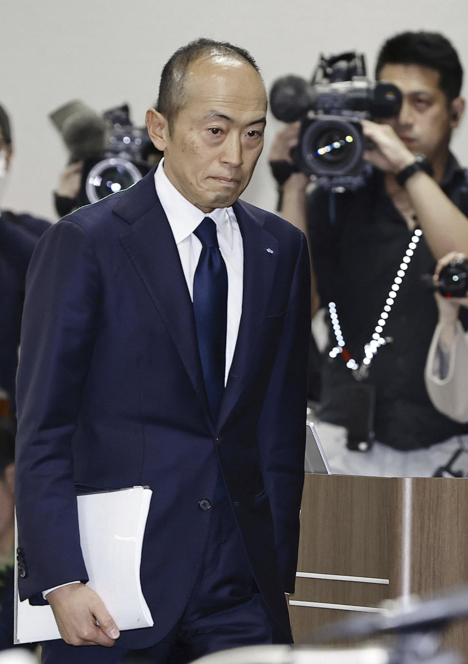 Akihiro Kobayashi, president of Kobayashi Pharmaceutical Co., arrives at a news conference in Osaka, western Japan, Friday, March 29, 2024. In the week since a line of Japanese health supplements began being recalled, several people have died and more than 100 people were hospitalized as of Friday. The Osaka-based pharmaceutical company came under fire for not going public quickly with problems known internally as early as January. The first public announcement came March 22. (Yohei Fukuyama/Kyodo News via AP)