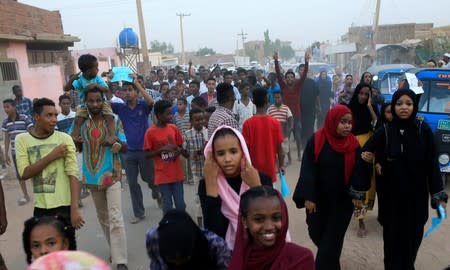 Sudanese protesters chant slogans as they demonstrate against the ruling military council, in Khartoum