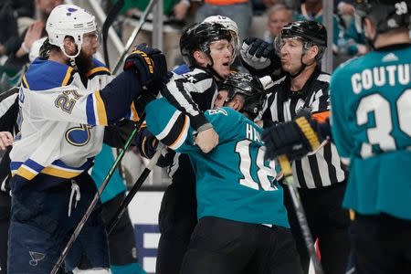 May 19, 2019; San Jose, CA, USA; Referee separates San Jose Sharks center Micheal Haley (18) and St. Louis Blues defenseman Alex Pietrangelo (27) during the third period in Game 5 of the Western Conference Final of the 2019 Stanley Cup Playoffs at SAP Center at San Jose. Mandatory Credit: Stan Szeto-USA TODAY Sports