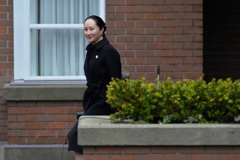 Huawei CFO Meng leaves her home to attend her extradition hearing in Vancouver