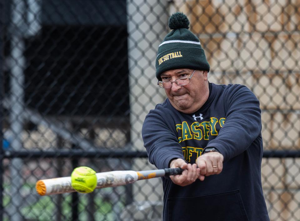 RBC Softball Coach Tony Flego warms his team up before game. Red Bank Catholic Girls Softball defeats Wall 6-2 in home game on April 4, 2024