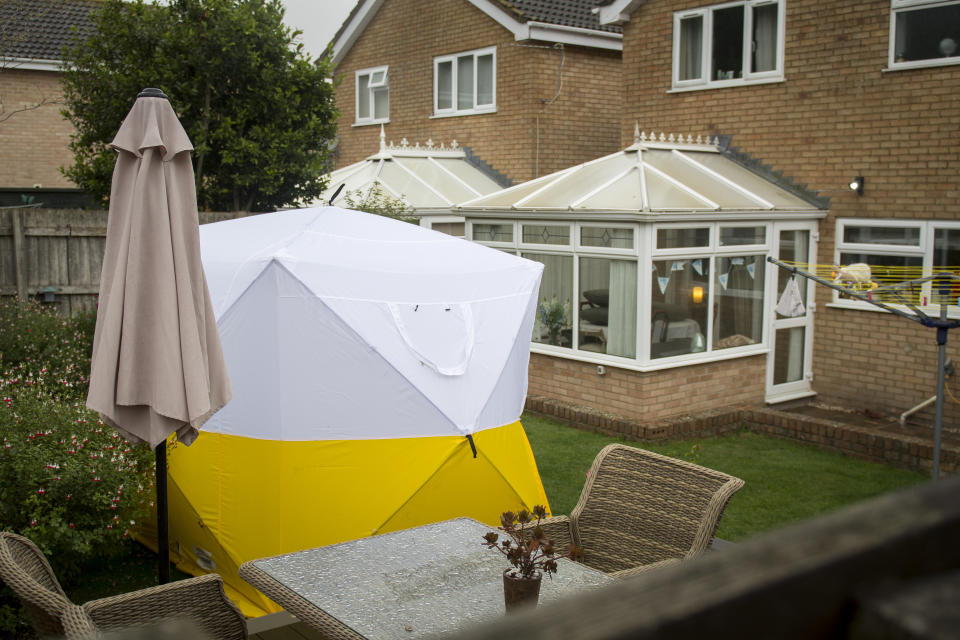 Police at a property in Swindon during the investigation. (SWNS)