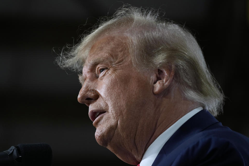 Former President Donald Trump speaks during a commit to caucus rally, Monday, Oct. 16, 2023, in Adel, Iowa. (AP Photo/Charlie Neibergall)