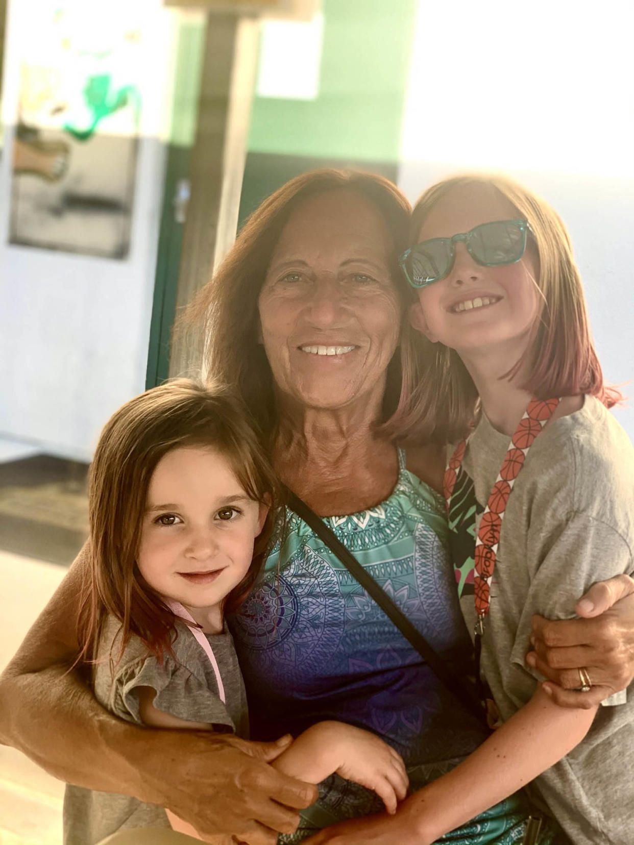 Carol Rosen and granddaughters Harleigh Murray (left) and Brooklyn Murray (right) visit the Irish Cottage restaurant in Methuen, Massachusetts. Rosen, a 70-year-old retired schoolteacher, passed her final days in anguish, after three weeks of chemotherapy with incompatible drugs.  (Lindsay Murray / KFF Health News)