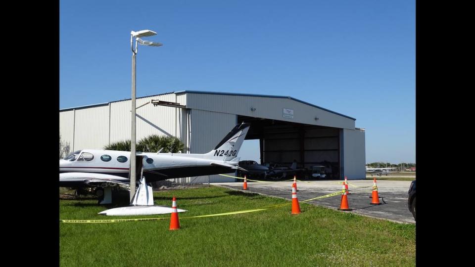 The accused plane thief flicked on the lights of another aircraft in the hanger before boarding the first plane and crashing it into a fence, officers said.
