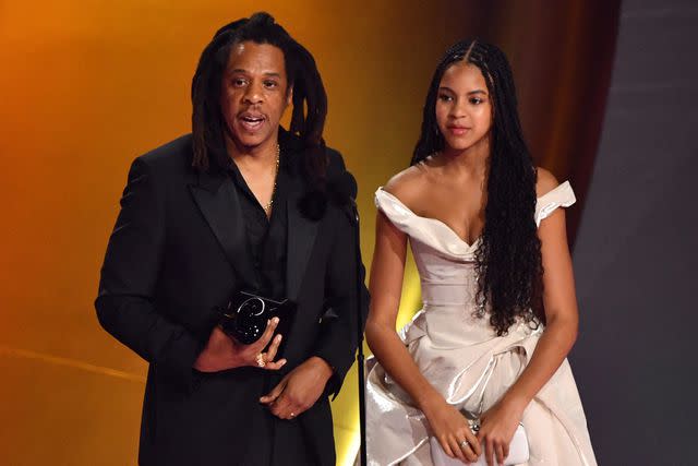 <p>VALERIE MACON/AFP via Getty Images</p> Jay-Z (L) accepts the Dr. Dre Global Impact Award alongside his daughter Blue Ivy on stage during the 66th Annual Grammy Awards