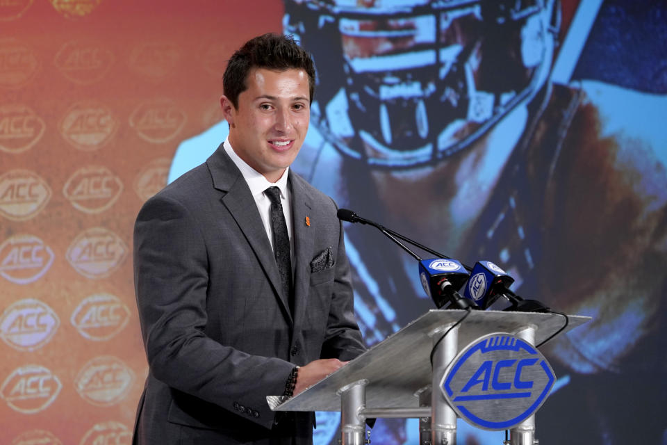 Syracuse's Tommy DeVito speaks during the Atlantic Coast Conference NCAA college football media day in Charlotte, N.C., Wednesday, July 17, 2019. (AP Photo/Chuck Burton)