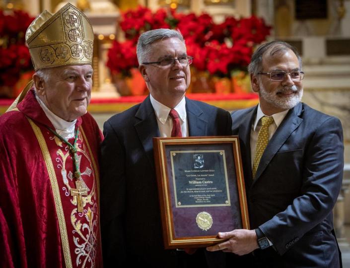 Miami, FL- December 1, 2022 -Archbishop of Miami Thomas Wenski, recipient of the Lex Christi, Lex Amoris Award William Castro and presenter of the award Raoul Cantero, pose for photos at Gesu Catholic Church in downtown Miami. Castro, a former attorney who was imprisoned in a notorious corruption scandal in the 1990s has since rebuilt his life and career helping the community. He was awarded the Lex Christi, Lex Amoris award by the Miami Catholic Lawyers Guild.