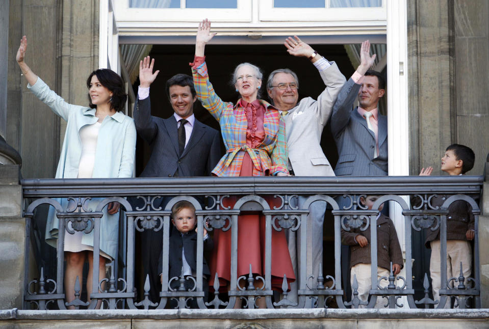 FILE - From left to right, Crown Princess Mary, Crown Prince Frederik, Prince Christian, Queen Margrethe, Prince Henrik, Prince Joachim, Prince Felix and Prince Nikolai wave on the balcony of Amalienborg Palace in Copenhagen, Denmark, Monday April 16, 2007. Before Margrethe, 83, announced that she would resign, most royal watchers assumed she would live out her days on the throne, as is tradition in Denmark. Margrethe had showed no signs of wanting to retire from her largely ceremonial position. Until recently, she had insisted that she considered being queen a job for life. (AP Photo/John McConnico, File)