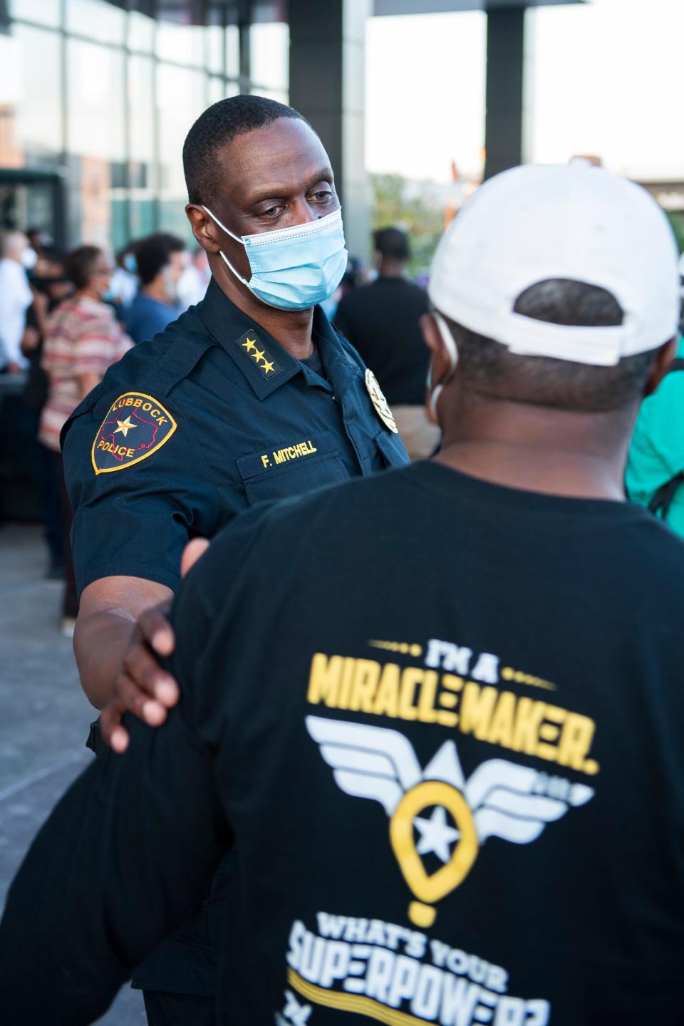 Lubbock Police Chief Floyd Mitchell greets a member of the community at Citizen's Tower after the Silent Solidarity Walk on Monday, June 1, 2020, in Lubbock. The Silent Solidarity Walk was organized by 100 Black Men of West Texas to protest police brutality in the wake of the death of George Floyd in Minneapolis.