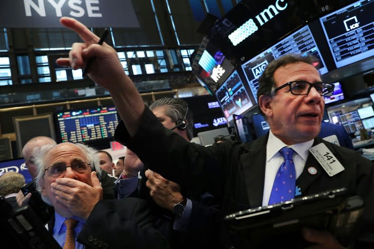 Traders work on the floor of the New York Stock Exchange the morning after Donald Trump's victory