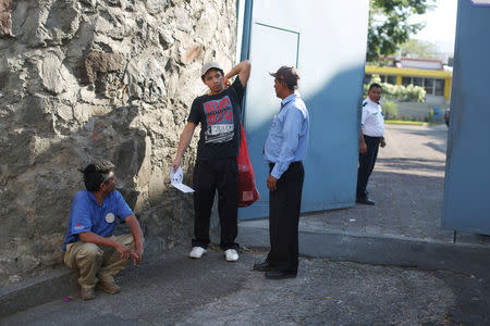 A deportee walks out at an immigration facility after a flight carrying illegal immigrants from the U.S. arrived in San Salvador, El Salvador, January 11, 2018. Picture taken January 11, 2018. REUTERS/Jose Cabezas