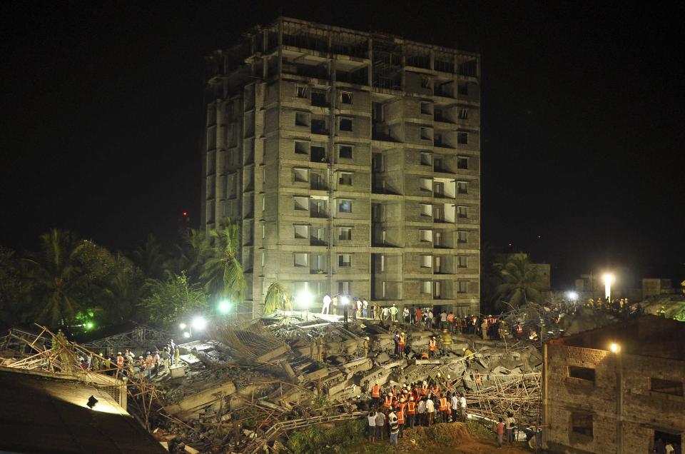 Rescue workers conduct a search operation for survivors at the site of a collapsed 11-storey building that was under construction on the outskirts of Chennai