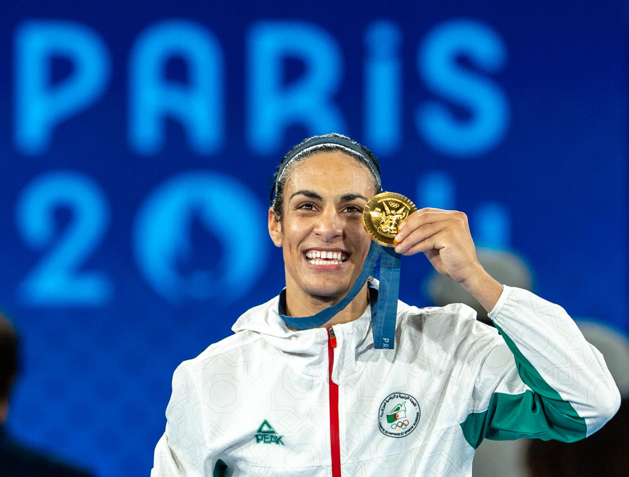 PARIS, FRANCE - AUGUST 09: Imane Khelif of Team Algeria celebrates as she wins gold medal after defeating Liu Yang (blue) of China in the Boxing Women's 66kg Final match on day fourteen of the Olympic Games Paris 2024 at Roland Garros on August 09, 2024 in Paris, France. (Photo by Aytac Unal/Anadolu via Getty Images)