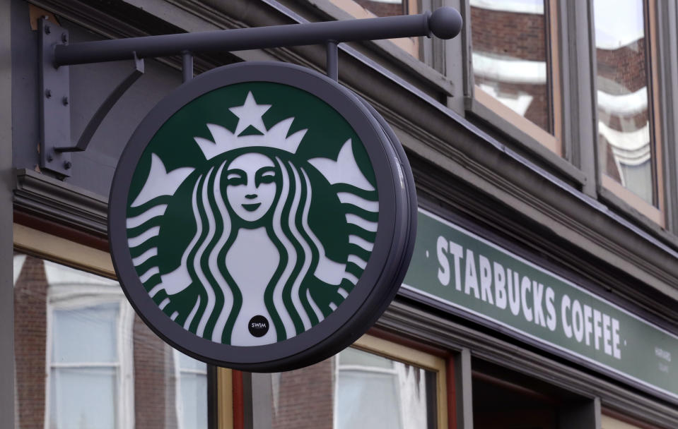 FILE- This Dec. 13, 2018, file photo shows a sign for a Starbucks Coffee shop in Harvard Square in Cambridge, Mass. Starbucks Corp. reports financial results Thursday, Jan. 24, 2019. (AP Photo/Charles Krupa, File)