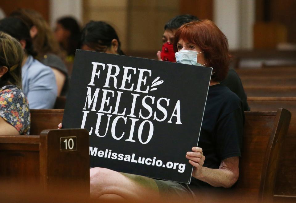 Rachelle Zoca, of Chicago, holds a sign during a vigil for Melissa Lucio at the Basilica Of Our Lady of San Juan del Valle National Shrine, Friday, April 22, 2022, in San Juan, Texas. Lucio is the first woman of Hispanic descent in Texas to be sentenced to death.