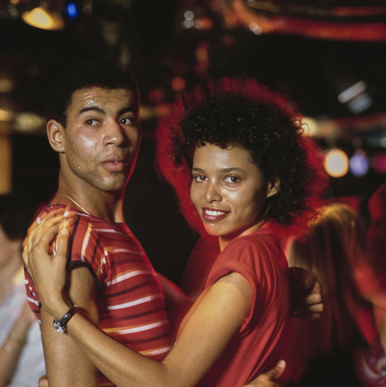 70s slang pictured: 70s couple disco dancing | (Photo by David Redfern/Redferns/Getty Images)