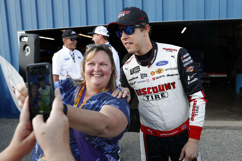 Brad Keselowski poses for a photo after winning the pole for the NASCAR Cup Series auto race at Michigan International Speedway in Brooklyn, Mich., Friday, Aug. 9, 2019. (AP Photo/Paul Sancya)