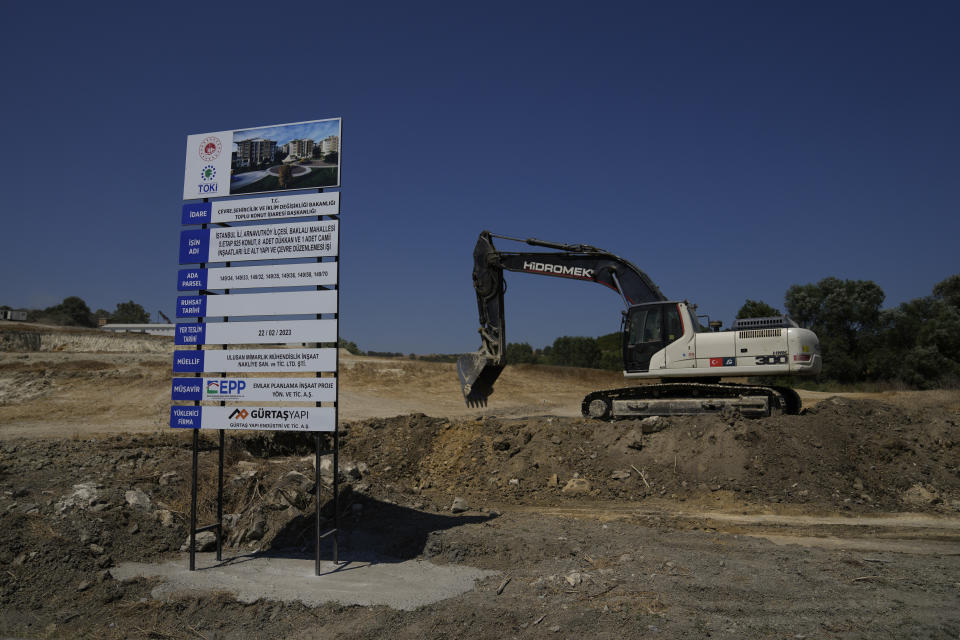 An excavator works on the site of a new governmental housing project in Istanbul, Turkey, Friday, Aug. 4, 2023. Six months ago today, a devastating 7.8-magnitude earthquake hit the Kahramanmaras and 10 other provinces in southern Turkey on the morning of February 6th. Over 50,000 people died, and hundreds of thousands were left homeless, sheltering in tents and other temporary accommodation. (AP Photo/Khalil Hamra)