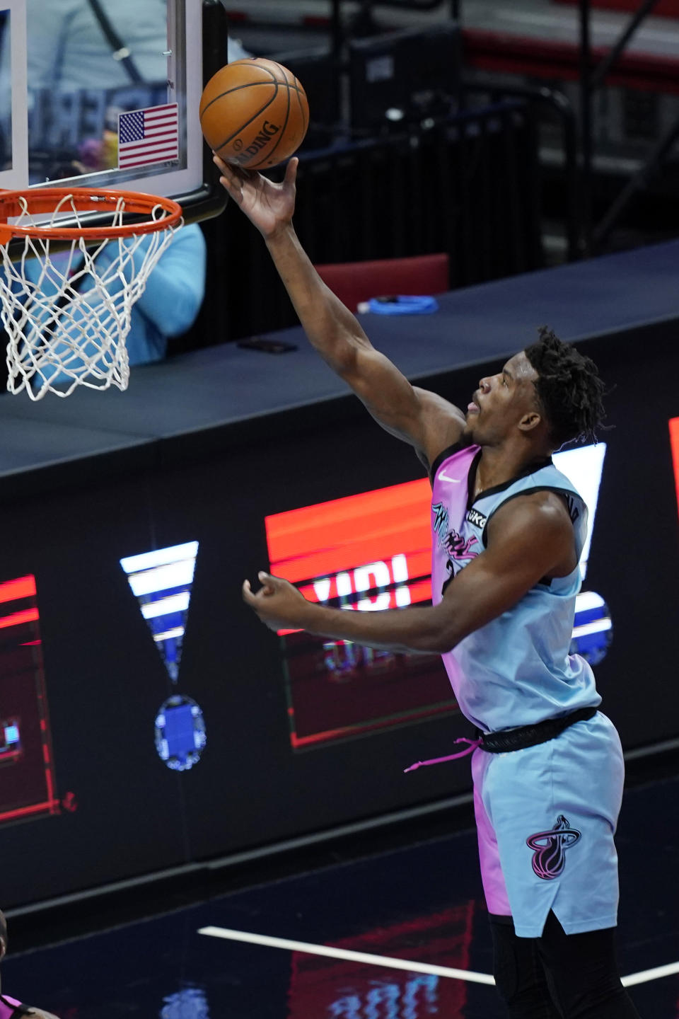 Miami Heat forward Jimmy Butler (22) drives to the basket during the first half of an NBA basketball game against the Sacramento Kings, Saturday, Jan. 30, 2021, in Miami. (AP Photo/Marta Lavandier)