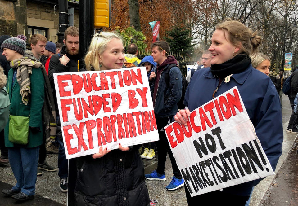 People outside the University of Glasgow after members of the University and College Union begin an eight-day strike in rows over pay, conditions and pensions.