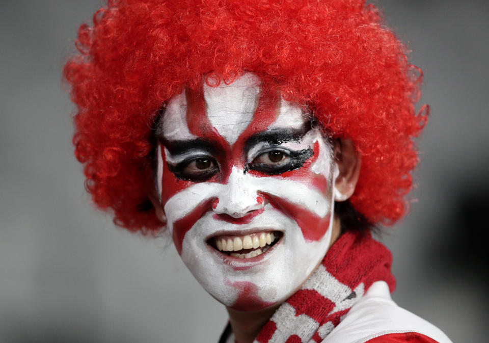 A Japanese fan reacts after his team's 30-10 win over Russia during the Rugby World Cup Pool A game at Tokyo Stadium in Tokyo, Japan, Friday, Sept. 20, 2019. (AP Photo/Jae Hong)