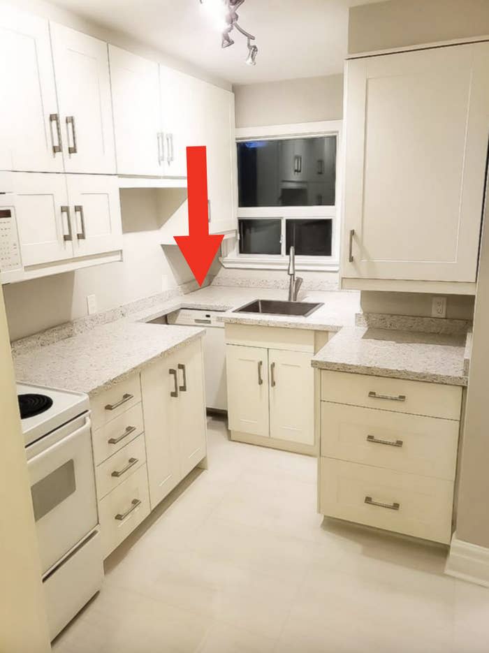 The dishwasher is placed in a corner that you can barely open it.