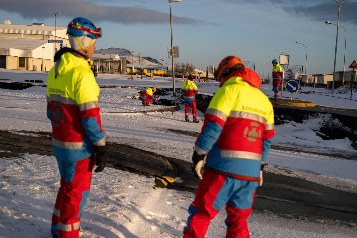 Members of the emergency services observe the damage caused by the earthquakes. (Raul Moreno/SOPA Images/LightRocket via Getty Images)