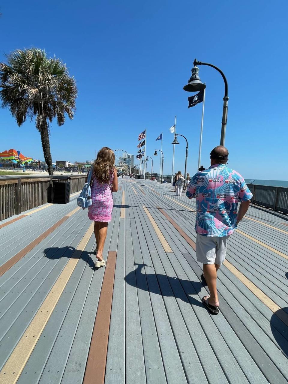 Tierney and Brian Boone show off the Boardwalk in downtown Myrtle Beach for their latest YouTube video. Their channel, Beachin with the Boones, focuses on the best things about the Grand Strand. Sept. 4, 2023