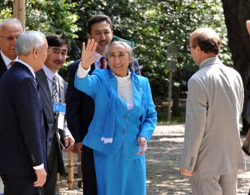 Exiled president of the World Uighur Congress Rebiya Kadeer waves to wellwishers as she leaves the Yasukuni shrine in Tokyo. Kadeer says her people face a fight for their very existence against Chinese repression as a conference in Japan threatens to drive a wedge between Tokyo and Beijing