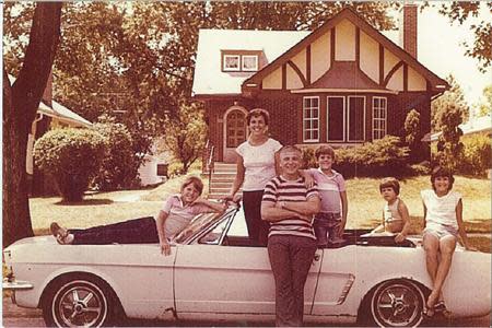 Gail (2nd L) and Tom Wise pose outside their home with their children (L-R) Michael, Tim, Laura and Sally on their Skylight Blue 1964 1/2 Ford Mustang convertible in Park Ridge, Illinois in July 1979. Gail Wise,t hen using her maiden name of Gail Brown, made the first known retail purchase of a Mustang on April 15, 1964, two days before the model went on sale. The car was garaged shortly after the photo was taken, until its restoration by Tom Wise 27 years later. REUTERS/Courtesy of Tom and Gail Wise/Handout via Reuters