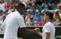 Nick Kyrgios of Australia (L) shakes the hand of Diego Schwartzman of Argentina after winning their match at the Wimbledon Tennis Championships in London, June 29, 2015. REUTERS/Stefan Wermuth