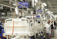 A view of hospital beds being assembled at the Linet factory in Slany, Czech Republic, Monday, Oct. 19, 2020. A Czech hospital bed maker with a full order book received one more order that was impossible to turn down. The company was approached by Prime Minister Andrej Babis to deliver beds for a military field hospital for 500 COVID-19 patients, to be built this week in Prague. (AP Photo/Petr David Josek)