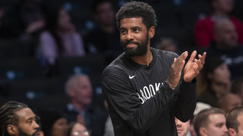 Brooklyn Nets guard Kyrie Irving reacts from the bench during the first half of an exhibition NBA basketball game against the Sesi/Franca Basketball Club, Friday, Oct. 4, 2019, in New York. (AP Photo/Mary Altaffer)