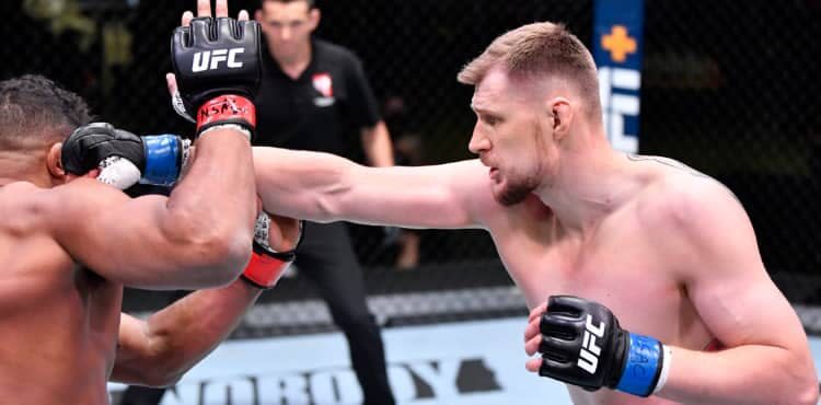 Alexander Volkov punches Alistair Overeem at UFC Vegas 18