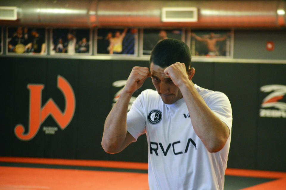 Mixed Martial Arts fighter Aaron Pico trains at the Jackson Wink MMA Academy on Monday, June 3, 2019, in Albuquerque, N.M. Pico said like many Mexican Americans he was inspired by Andy Ruiz Jr., who shocked the world Saturday by defeating Anthony Joshua in New York to became the first Mexican American boxing heavyweight champion of the world. (AP Photo/Russell Contreras)