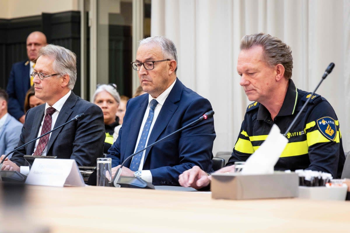 Mayor of Rotterdam Ahmed Aboutaleb  (centre) said “it was a black day” for the city (ANP/AFP via Getty)