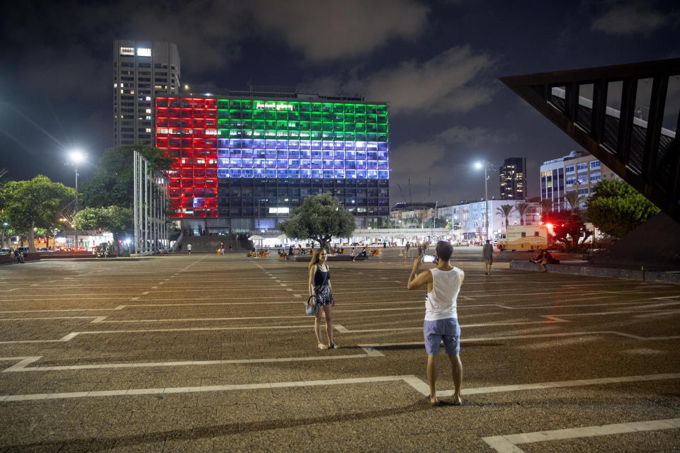 Tel Aviv City Hall is lit up with the flags of the United Arab Emirates and Israel as the countries announced they would be establishing full diplomatic ties, in Tel Aviv, Israel, Thursday, Aug. 13, 2020. In a nationally broadcast statement, Prime Minister Benjamin Netanyahu said the "full and official peace" with the UAE would lead to cooperation in many spheres between the countries and a "wonderful future" for citizens of both countries. (AP Photo/Oded Balilty)