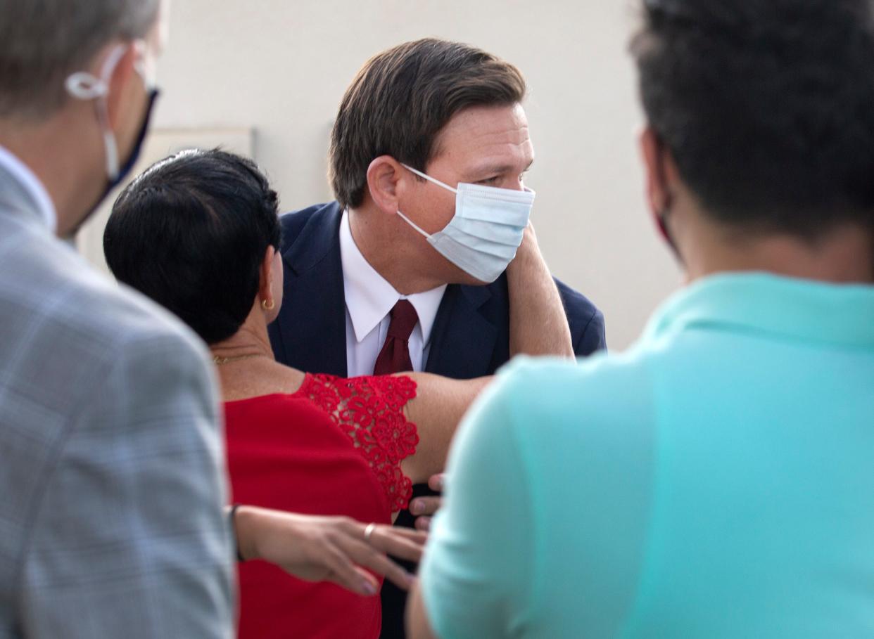 Gov. Ron DeSantis arrives at the Hilton Airport Palm Beach in West Palm Beach Friday, February 19, 2021. 