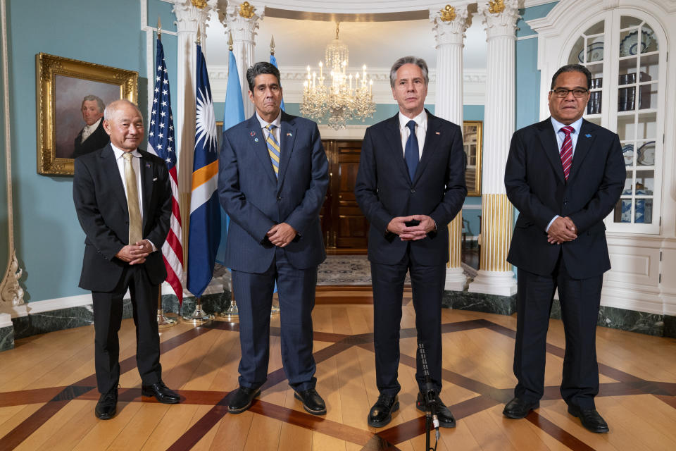 FILE- Secretary of State Antony Blinken, at center right, meets with, from left, Marshall Islands Foreign Affairs and Trade Minister Jack Ading, Palau's President Surangel Whipps, Jr., Blinken, and Micronesia's President Wesley Simina, Tuesday, Sept. 26, 2023, at the State Department in Washington. U.S. officials stressed Tuesday, March 19, 2024, that newly-approved legislation providing billions of dollars in funding for three strategically-important Pacific island nations is an important sign of American commitment, which comes amid warnings China is actively trying to pry them away from Washington's sphere of influence. (AP Photo/Jacquelyn Martin, File)