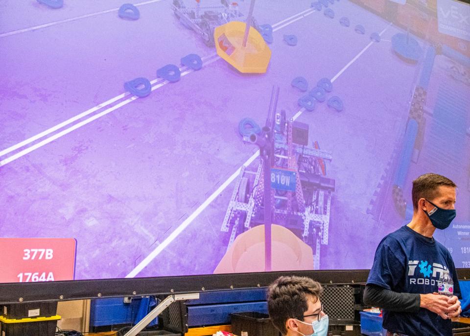 York High School Robotics club mentor Gerald Mackaman watches a qualifying match during the VEX Robotics Tournament hosted at YHS where 26 teams from across the state of Maine competed on Saturday, Nov. 13, 2021.